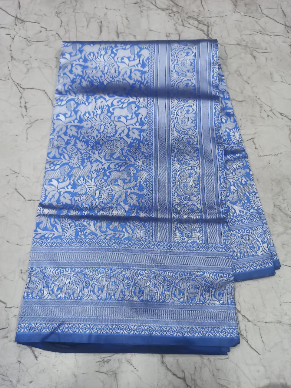 Blue Silk Saree with Intricate Floral Jacquard Work and Traditional Border