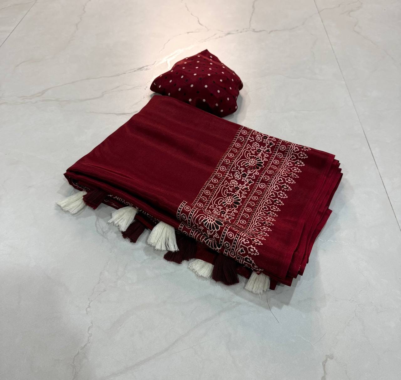 Premium Ajrakh Designer Crepe Silk Saree with Floral Border & Tassel Detailing