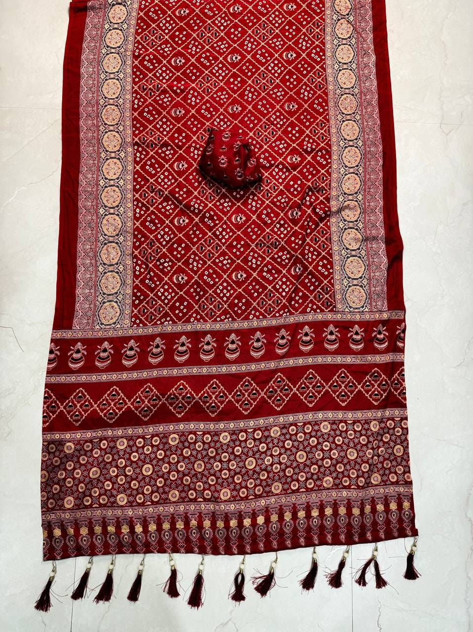 Premium Ajrakh Designer Crepe Silk Saree with Multi-Pattern Border & Tassel Work