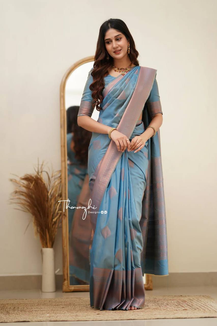Elegant Blue Silk Saree with Pink Border and Floral Motifs