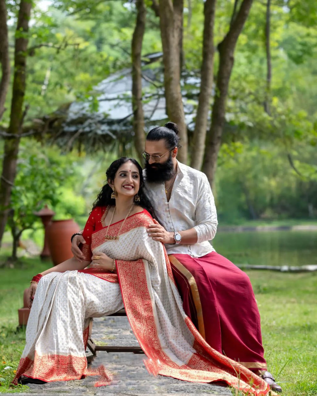 Elegant White Saree with Red Border and Gold Detailing