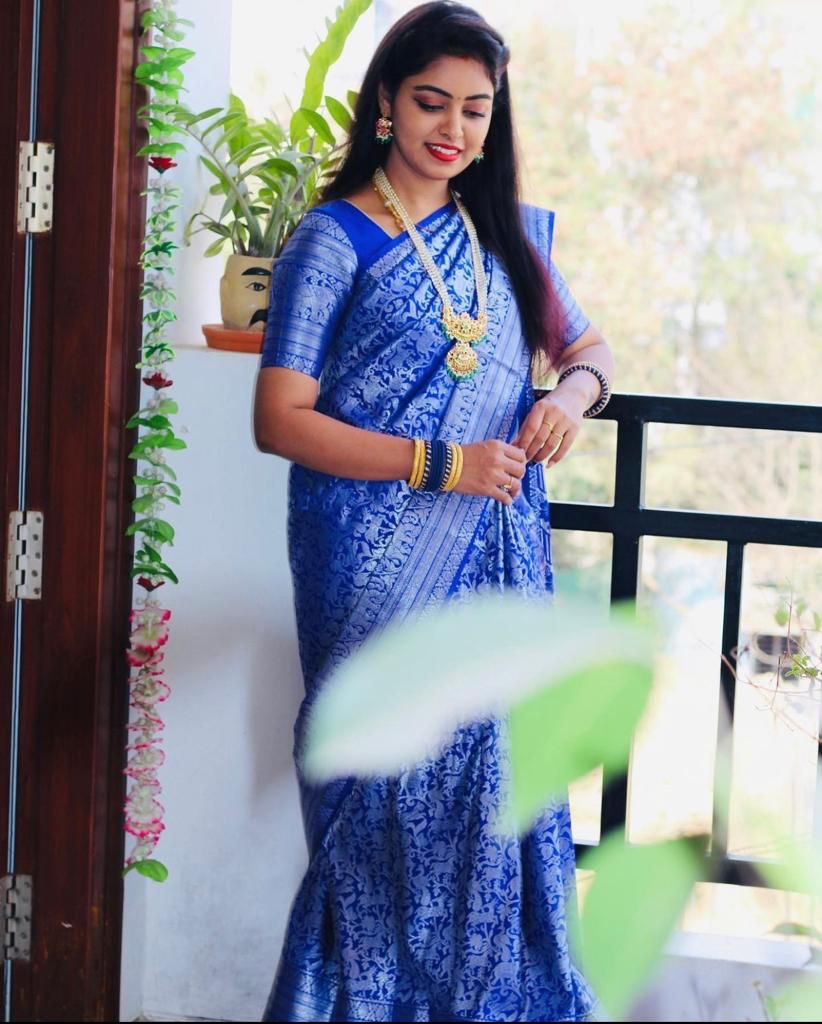 Blue Silk Saree with Intricate Floral Jacquard Work and Traditional Border