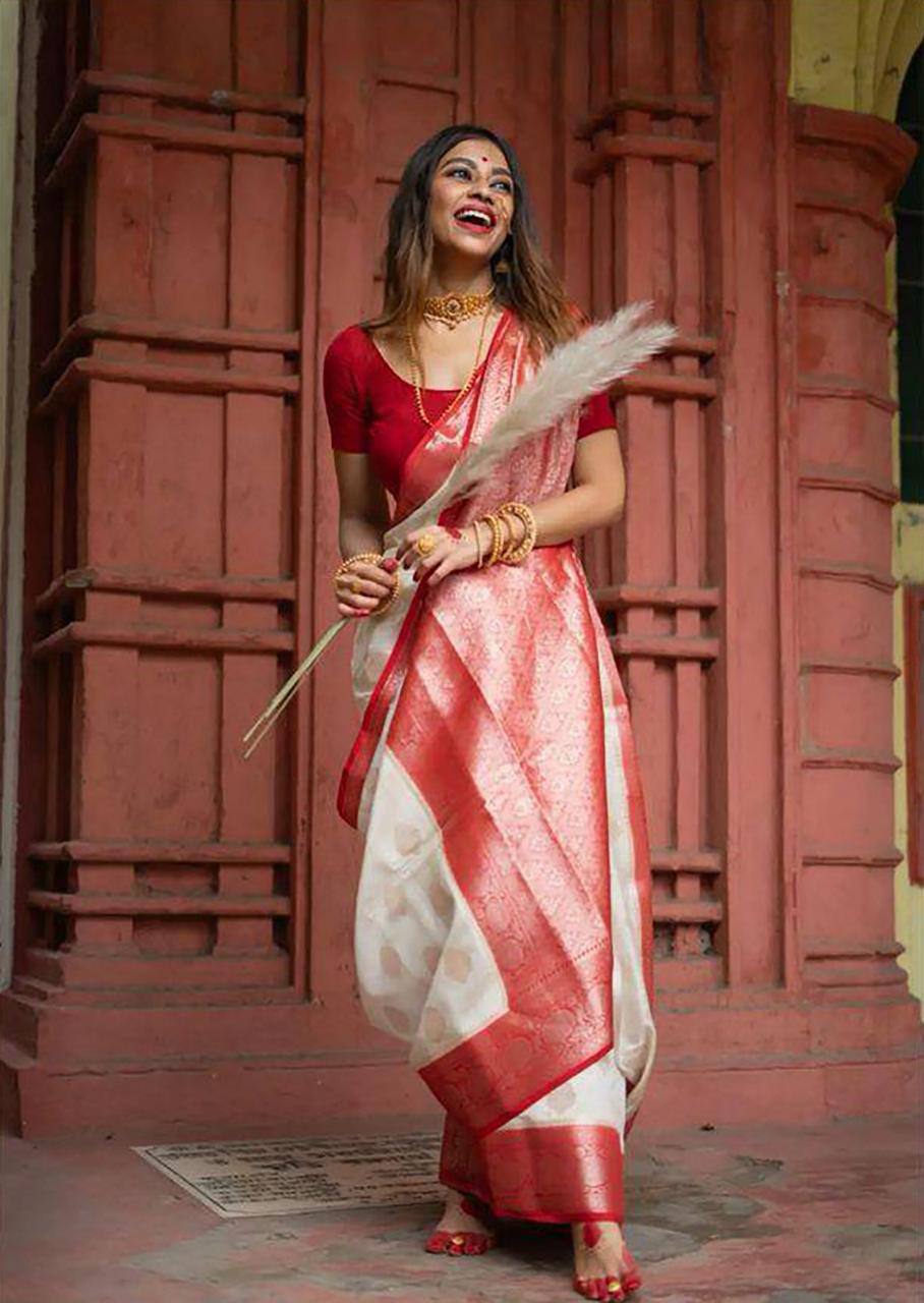 Elegant Off White Silk Saree with Red Zari Border and Floral Motifs