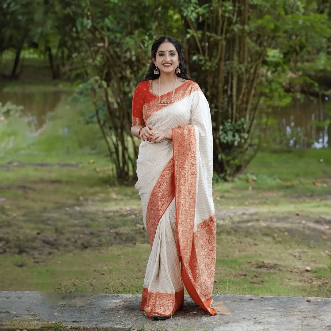 Elegant White Saree with Red Border and Gold Detailing