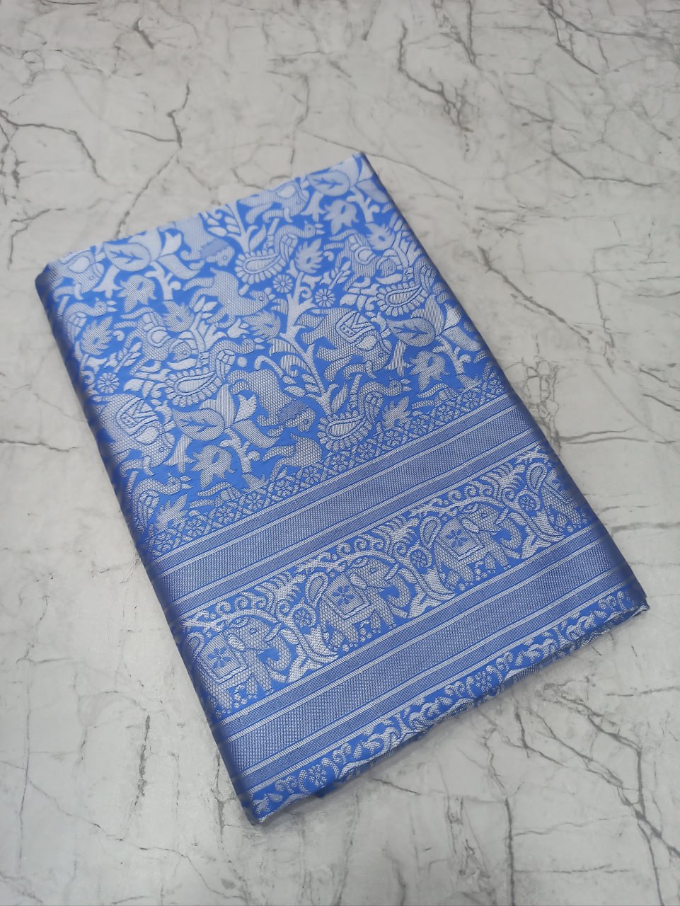 Blue Silk Saree with Intricate Floral Jacquard Work and Traditional Border