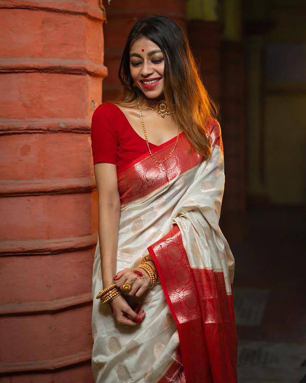 Elegant Off White Silk Saree with Red Zari Border and Floral Motifs