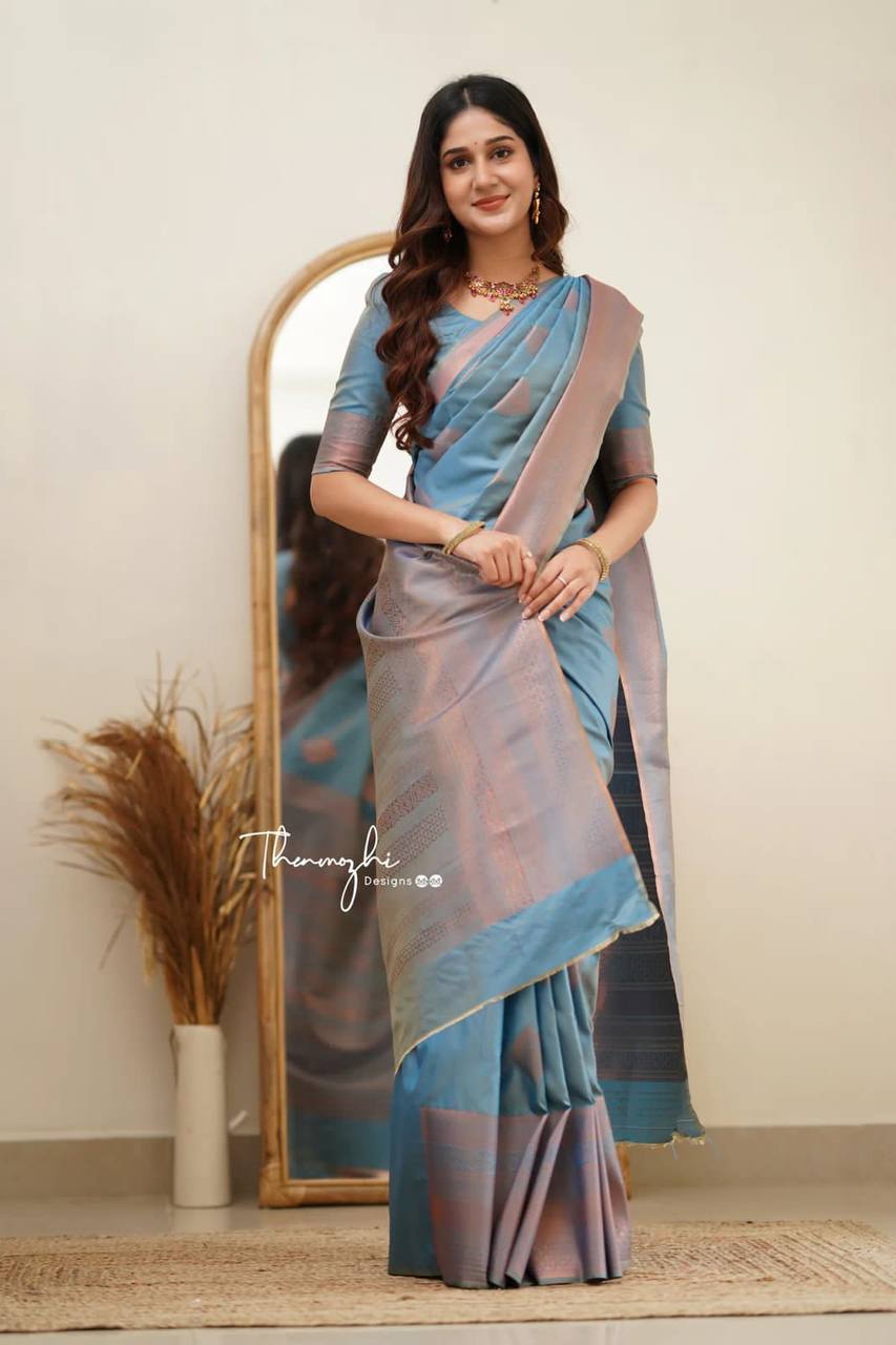 Elegant Blue Silk Saree with Pink Border and Floral Motifs