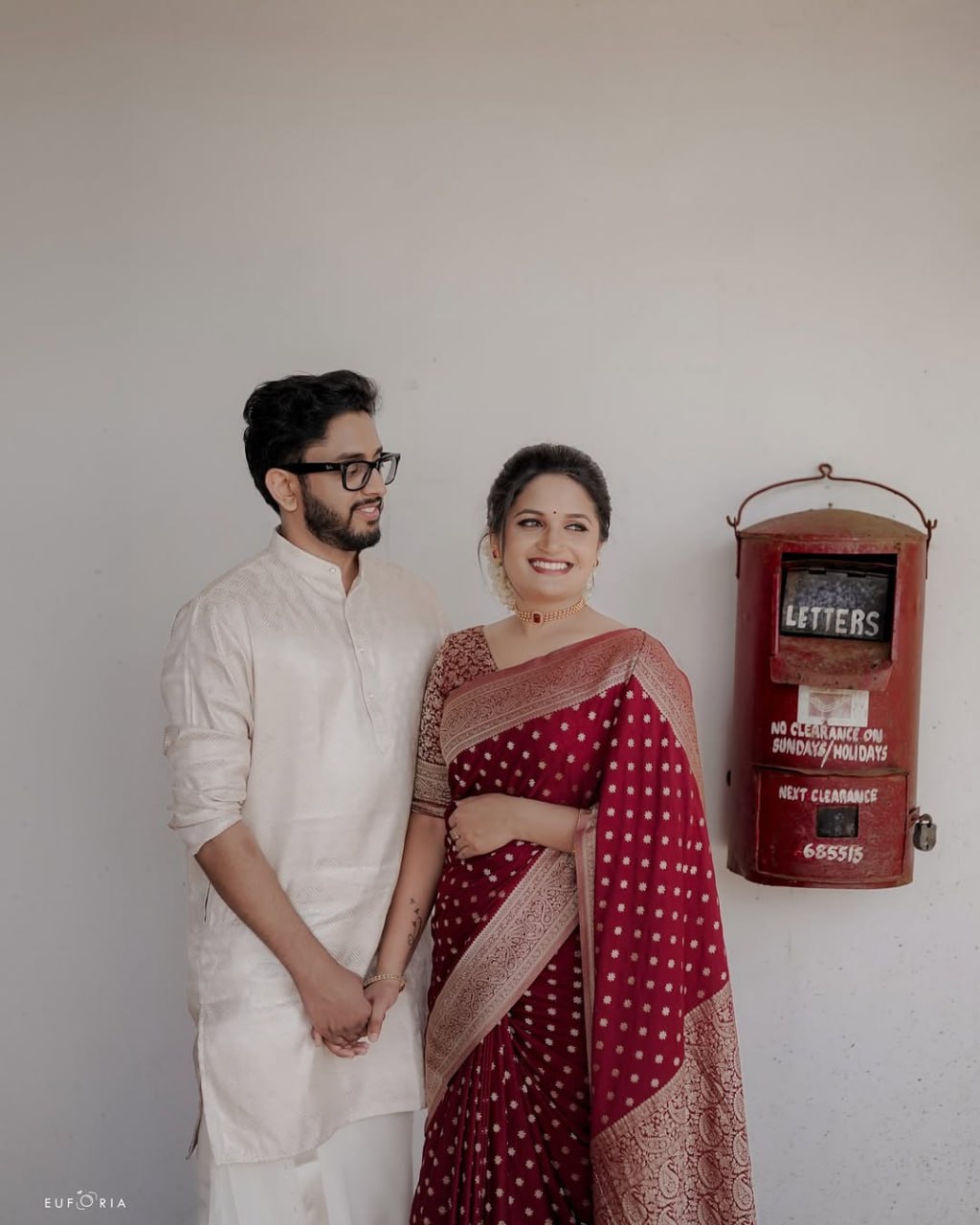 Maroon Banarasi Silk Saree with Golden Buti Work and Embroidered Blouse