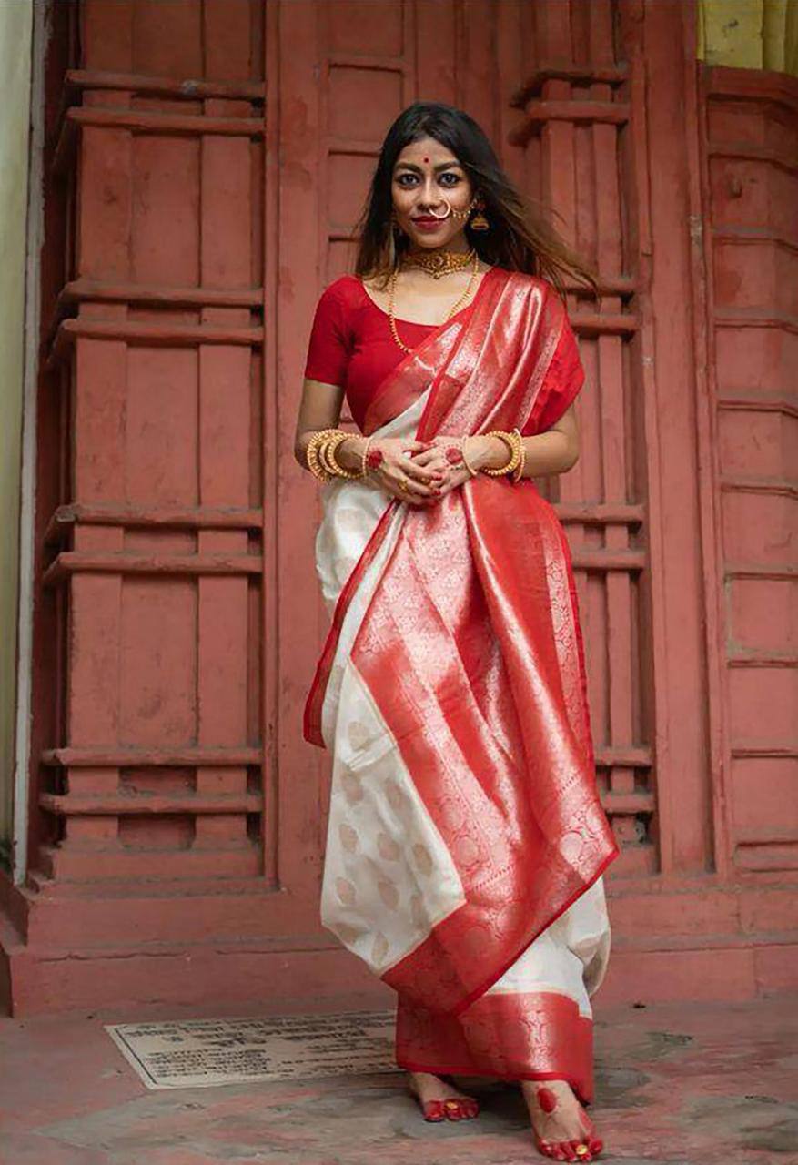 Elegant Off White Silk Saree with Red Zari Border and Floral Motifs