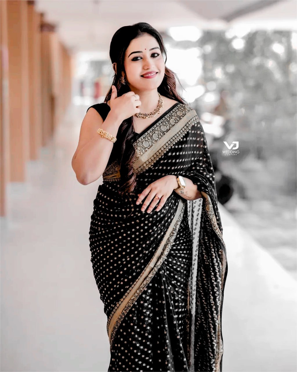 Elegant Black Saree with Golden Border and Sequin Work