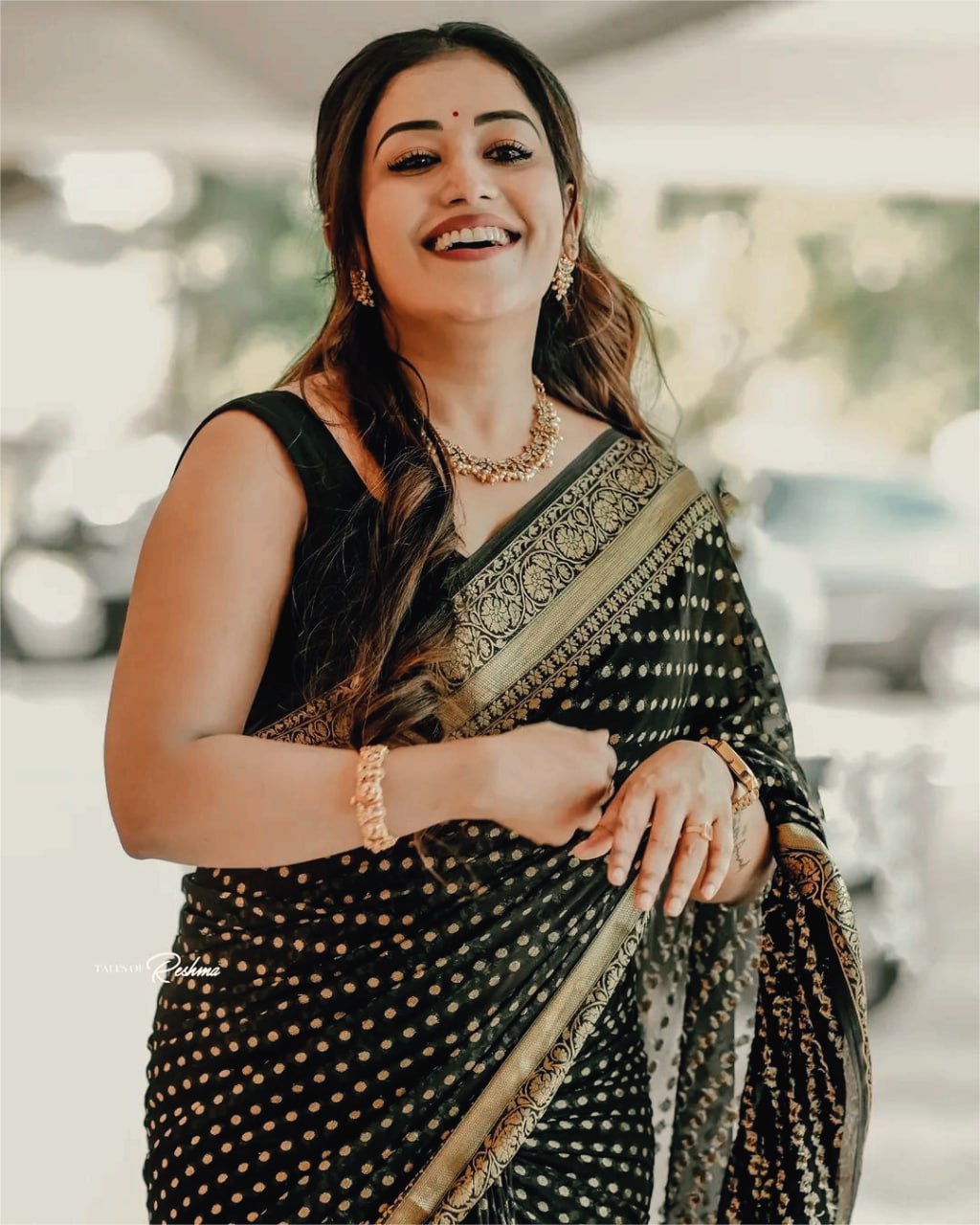 Elegant Black Saree with Golden Border and Sequin Work