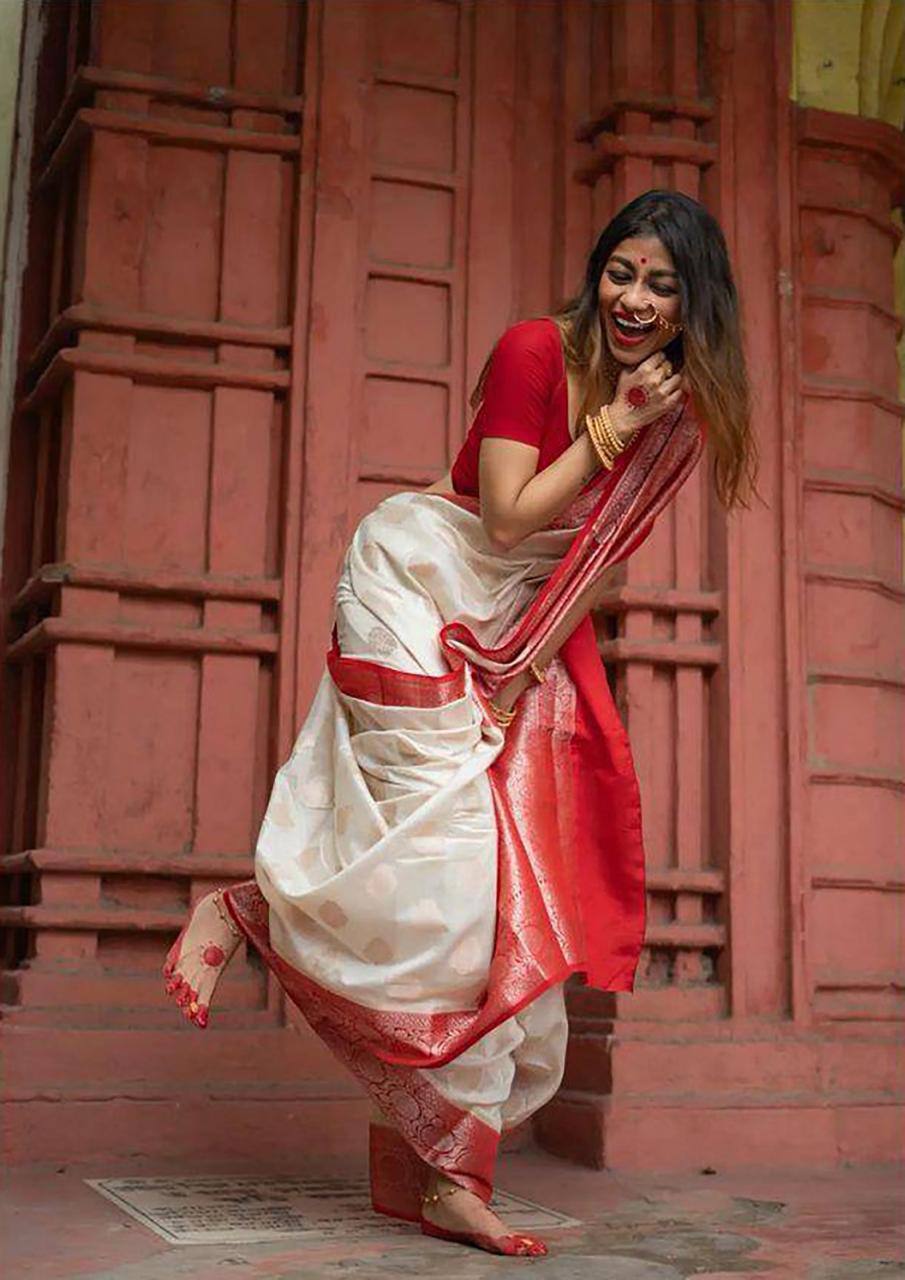 Elegant Off White Silk Saree with Red Zari Border and Floral Motifs