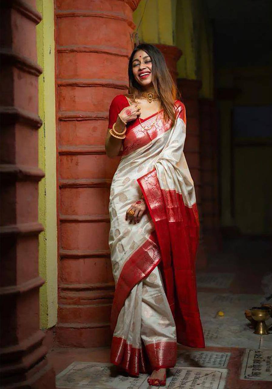 Elegant Off White Silk Saree with Red Zari Border and Floral Motifs